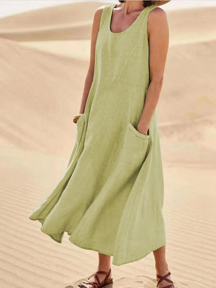 Versatile women's scoop-neck sleeveless midi dress with pockets. Great for casual, everyday, summer, or vacation wear.