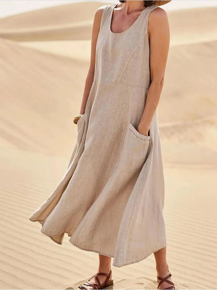 Women's sleeveless scoop-neck midi dress with pockets. Perfect casual summer dress for everyday wear or vacation.