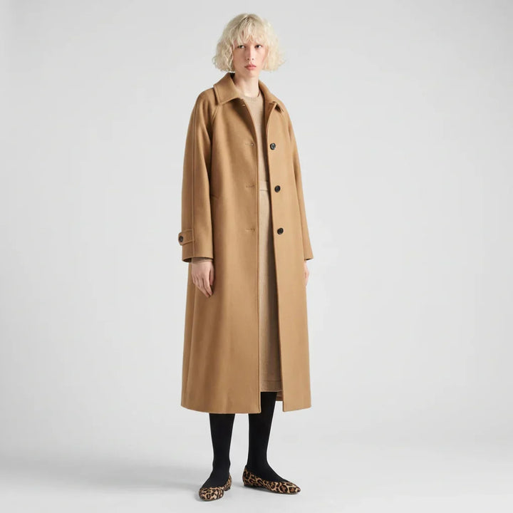 Elegant women's long trench coat in tailored classic style for winter fashion. Perfect chic fall outerwear.
