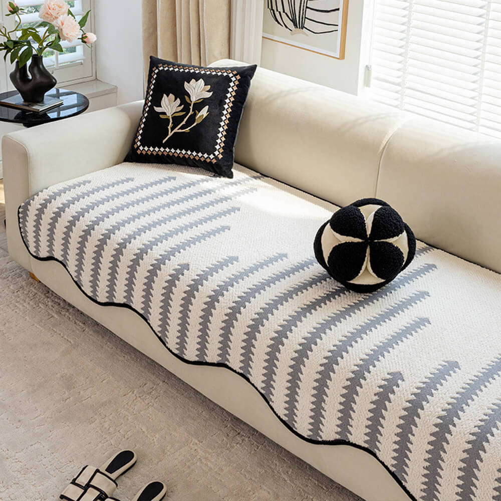 Textured modern chevron sofa cover with wavy edges. Enhances living room aesthetic & protects furniture. Pet-friendly.