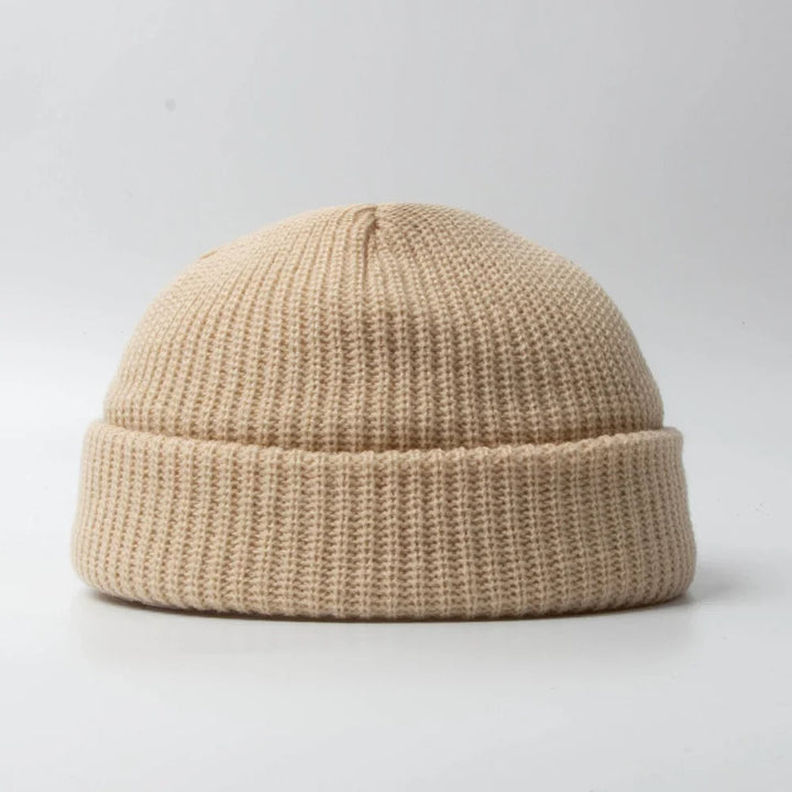 Unisex knit beanie skull cap in a solid color, perfect for winter warmth & casual style.