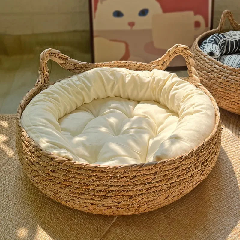Durable, eco-friendly handwoven rattan cat bed with a soft, washable cushion for pet comfort.