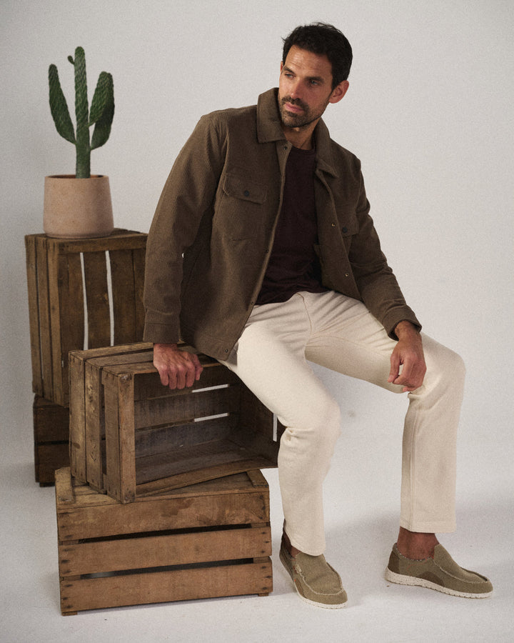 Side view of men's blue Dockstone slip-on canvas loafers, casual & comfortable walking shoes for easy wear.