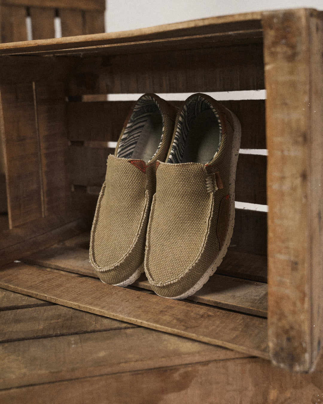 Close-up of comfortable khaki canvas texture on men's Dockstone slip-on shoes, ideal for everyday wear.