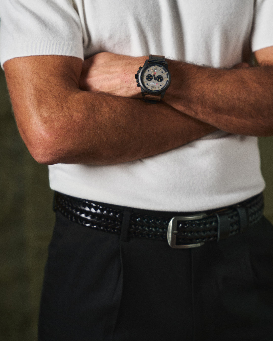 Durable men's cowhide leather belt with intricate braided design and sturdy metal buckle.
