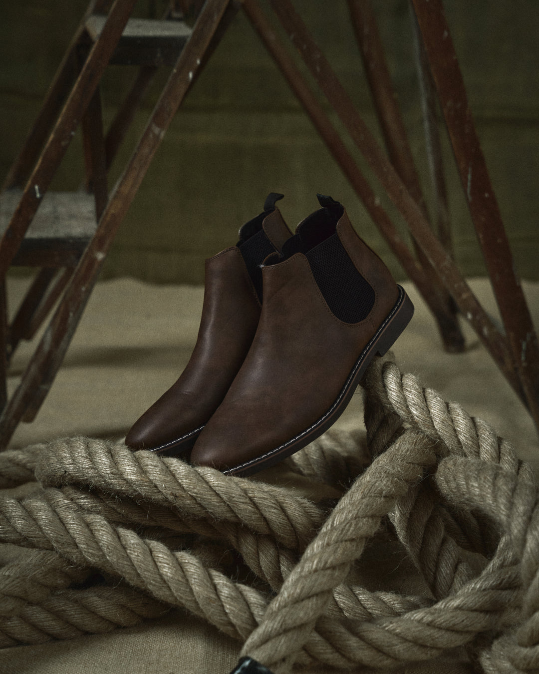 Classic men's slip-on Chelsea boots in sleek black leather, versatile dress & casual footwear.
