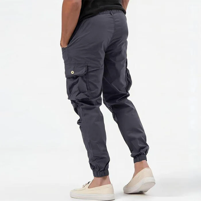 Tapered fit men's cargo joggers in stretch fabric. Comfortable & stylish activewear for everyday casual wear.