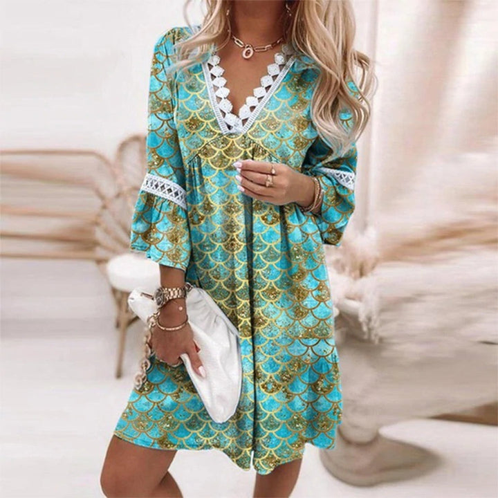 Elegant flowy knee-length crochet dress for women, featuring a stylish V-neck. Perfect for summer fashion & beach.