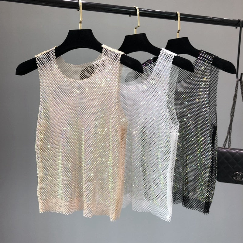 Statement piece women's dazzling party top. Sparkling sleeveless design for chic summer fashion & evening wear.