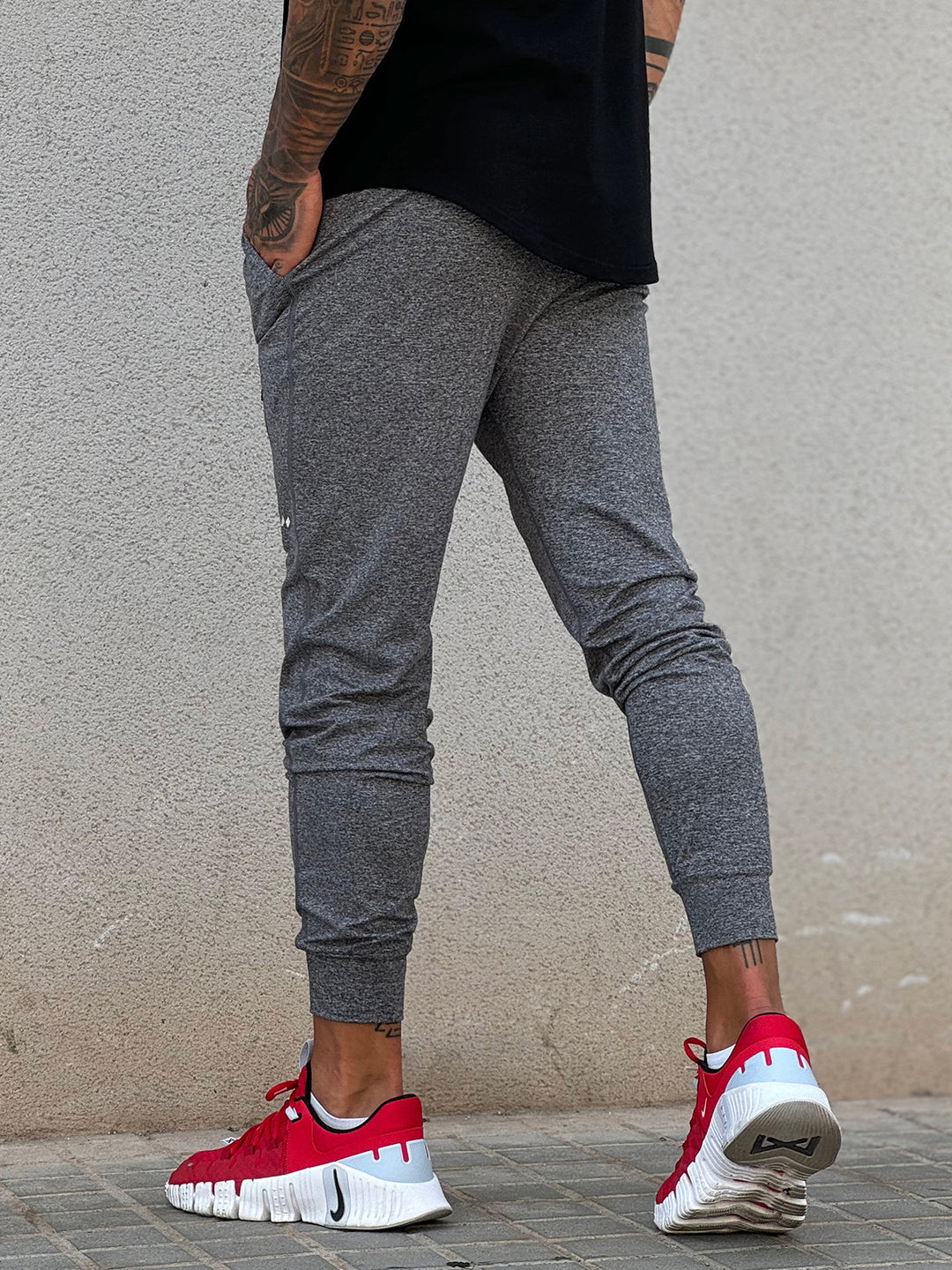 Flexible men's tapered fit joggers; stretch bottoms for athletic and casual comfort.