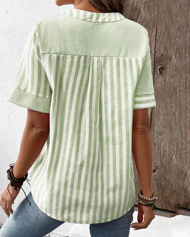 Women's striped colorblock blouse featuring a stylish half-button front, a must-have casual top.