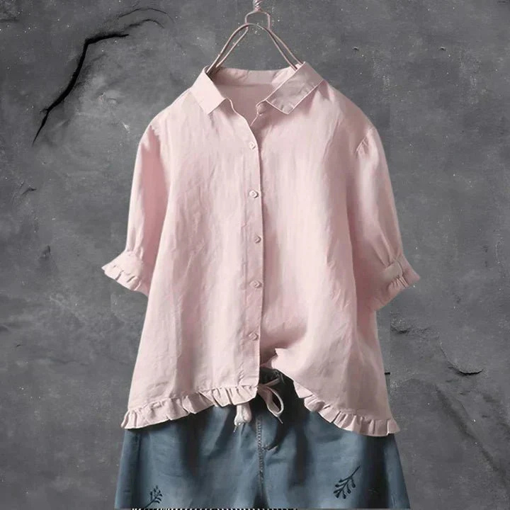 Light pink short-sleeve women's shirt featuring a chic ruffle-trim and relaxed-fit button-down design, ideal for summer.
