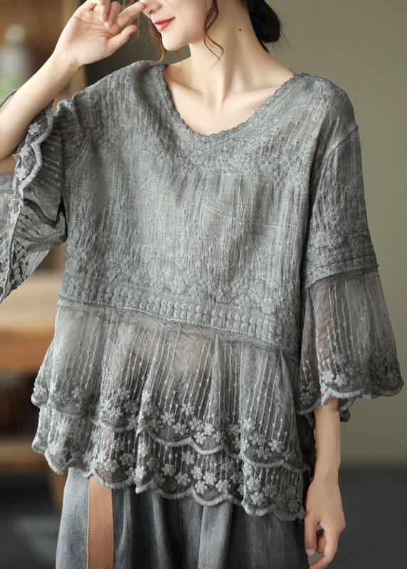 Embroidered women's blouse, half sleeves, tiered lace hem, & patchwork detail. Versatile boho top for any casual look.