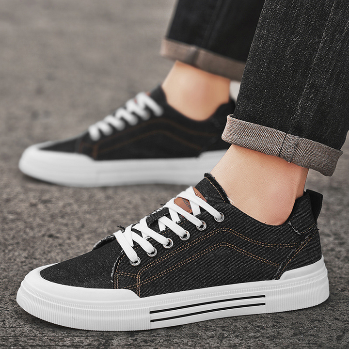 Sleek black men's casual sneakers, comfortable for urban walking and daily street wear.