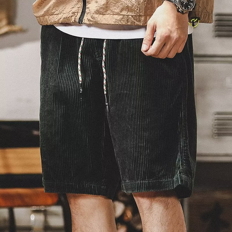 Green men's summer shorts with relaxed fit, perfect for casual wear and ultimate comfort.