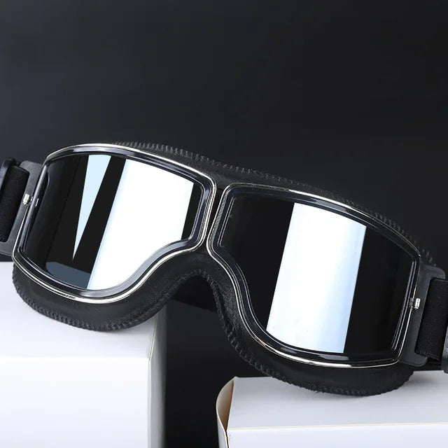 Classic retro motorcycle goggles for riders. UV protective, windproof, & adjustable strap.