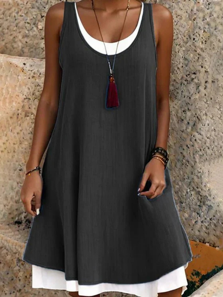 Effortless women's two-layer scoop neck sleeveless A-line dress, perfect for casual summer comfort.