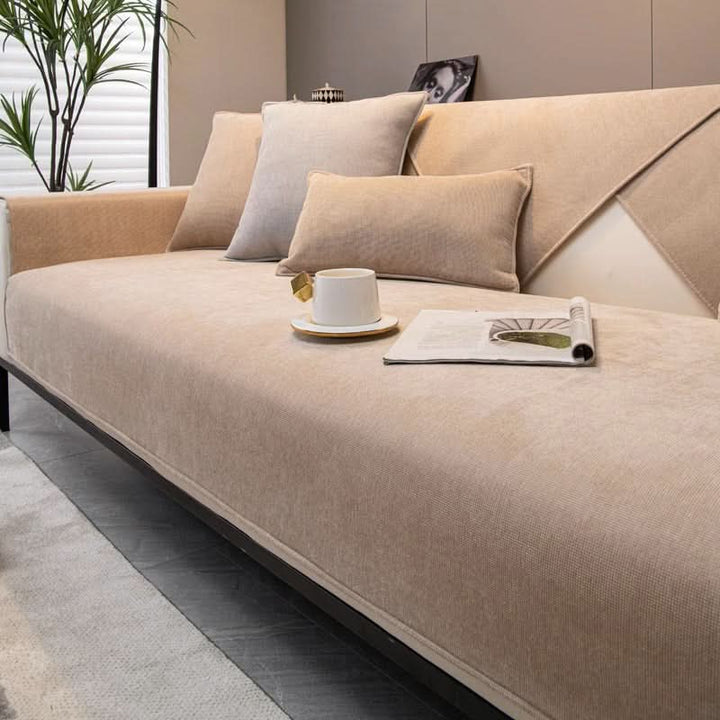 Pet-friendly grey sofa cover protecting living room couch. Modern design, durable, washable furniture slipcover.