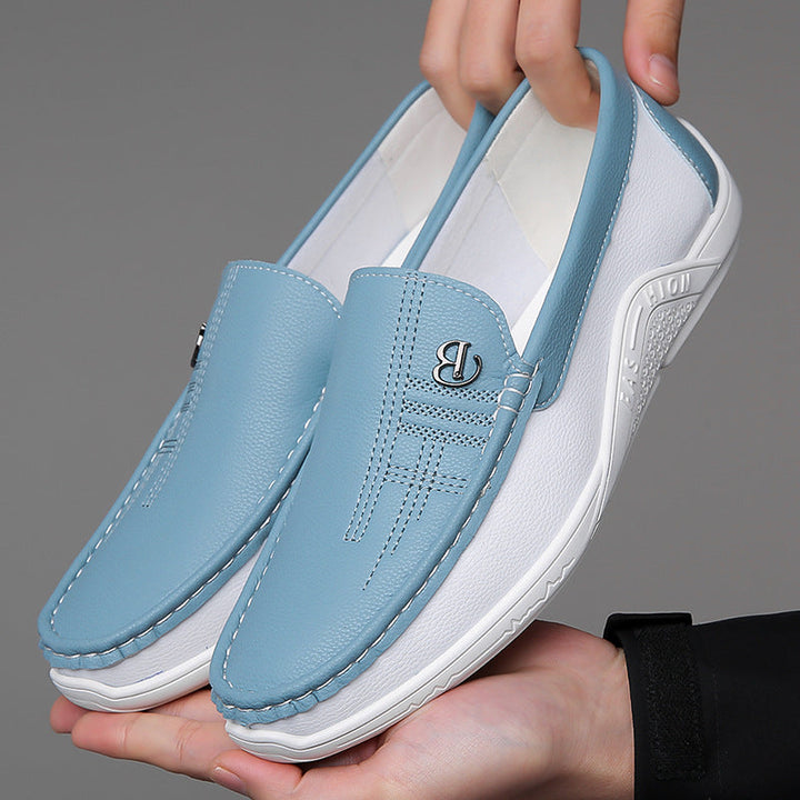 Fashion-forward men's two-tone slip-on loafers, providing elegant comfort and modern appeal.