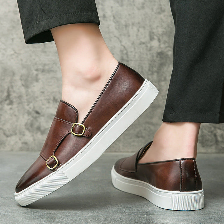 Men's fashionable monk strap loafers from a side angle, showcasing sleek design & comfortable fit.