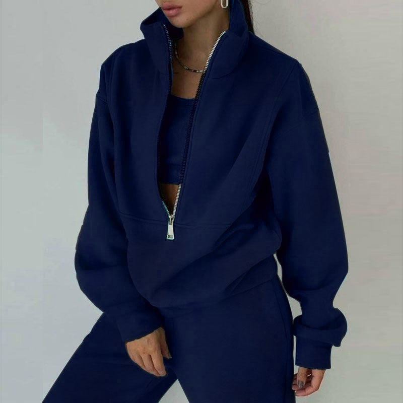 Chic athleisure women's sweatsuit. Half-zip top and high-waisted joggers for ultimate comfort & style.