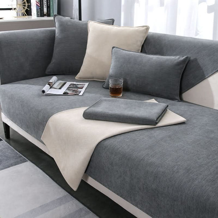 Close-up: Durable, washable grey sofa cover fabric. Modern design, soft couch slipcover for living room.