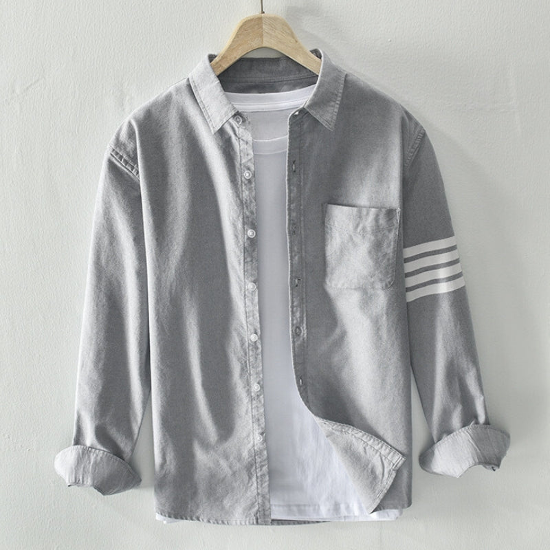 Men's classic button-up shirt unbuttoned. Perfect for versatile casual men's fashion, a long-sleeve wardrobe essential.