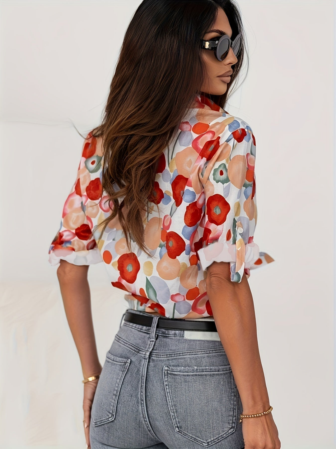 Elegant women's oversized floral button-down shirt, a vibrant long-sleeve blouse with a classic collar.