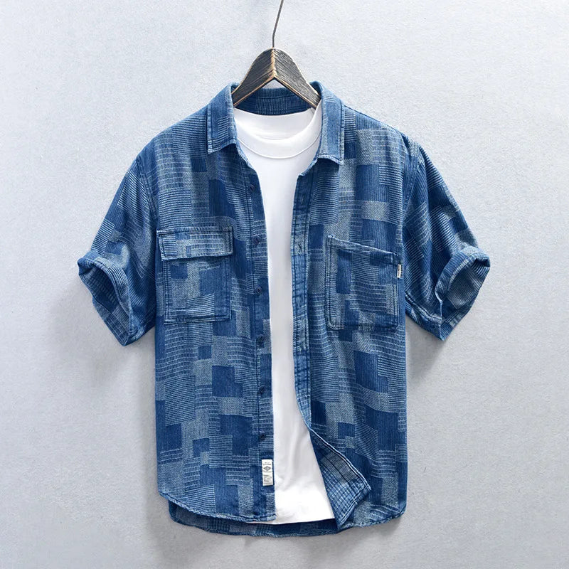 Stylish men's multi-pocket button-down shirt with long sleeves, perfect for casual everyday wear.