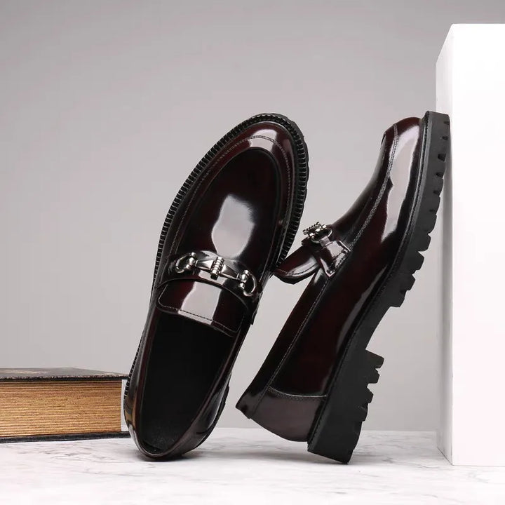 Classic men's slip-on loafers with a smooth finish, offering elegant style for formal occasions.