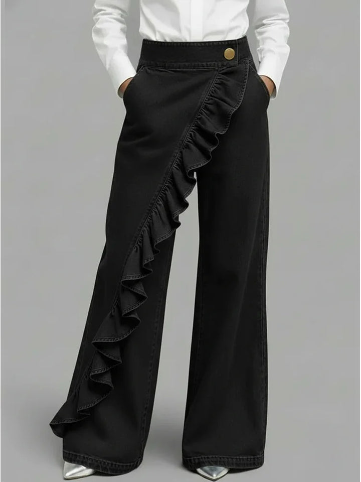 Comfortable high-rise wide leg jeans for women. Soft denim with elegant ruffle details. Perfect casual style.