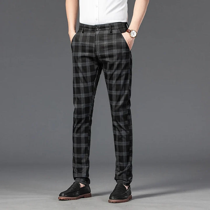 Men's slim fit plaid dress trousers for business casual or formal wear, featuring comfortable stretch fabric.