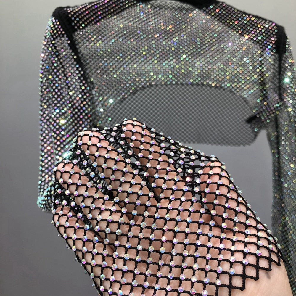 Effortless glam women's sparkling net top. Dazzling party wear, perfect for a chic night out or festival outfit.