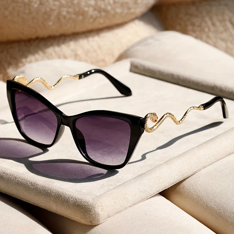 Close-up: Modern Serpentina unisex sunglasses, showcasing unique frame detail & fashion-forward design.