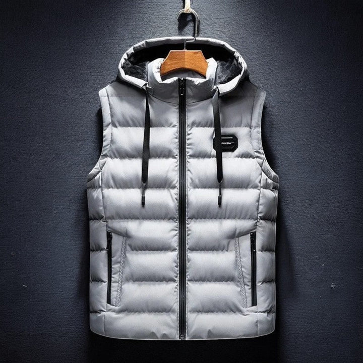 Casual men's hooded puffer vest for layering. Lightweight Midtown outerwear, perfect for fall, winter & travel.