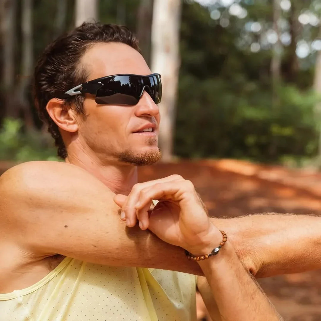 Silver mirrored men's sport sunglasses. Secure fit for active lifestyles, providing UV protection.