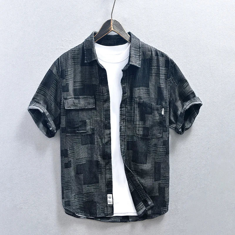 Blue men's button-down shirt featuring multiple pockets & long sleeves. A comfortable & stylish casual top.