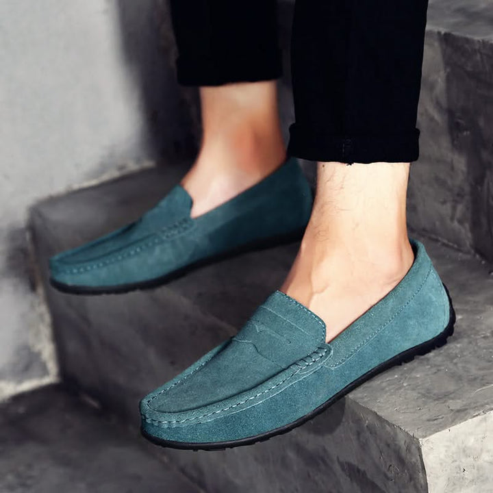 Close-up: Men's Hudson loafers, revealing detailed craftsmanship, comfort & elegant design. Slip-on footwear.