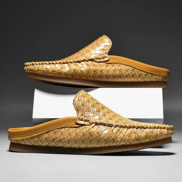 Black Durabreeze men's slip-on loafers with woven texture, offering smart casual style and breathable comfort.