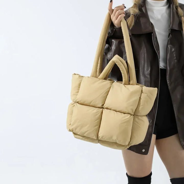 Detailed shot of a chic women's puffer tote, excellent for daily errands.