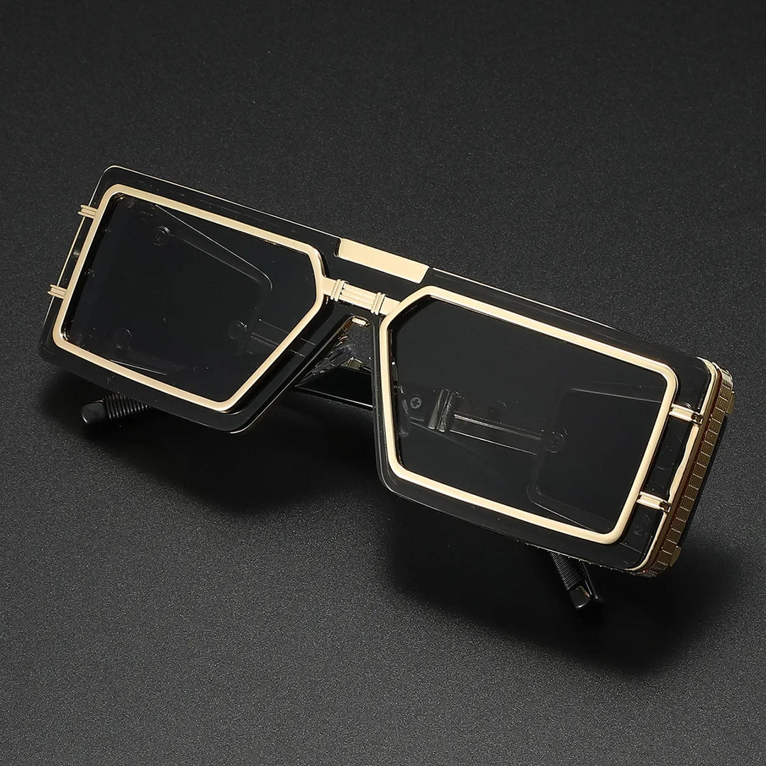Angular geometric sunglasses, bold unisex design with UV protection. Features stylish gold detail; a trendy accessory.