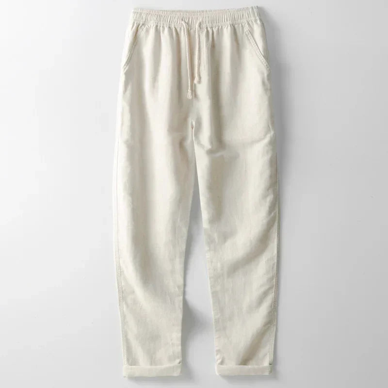 Person wearing relaxed-fit unisex linen trousers, demonstrating lightweight comfort ideal for casual summer days.