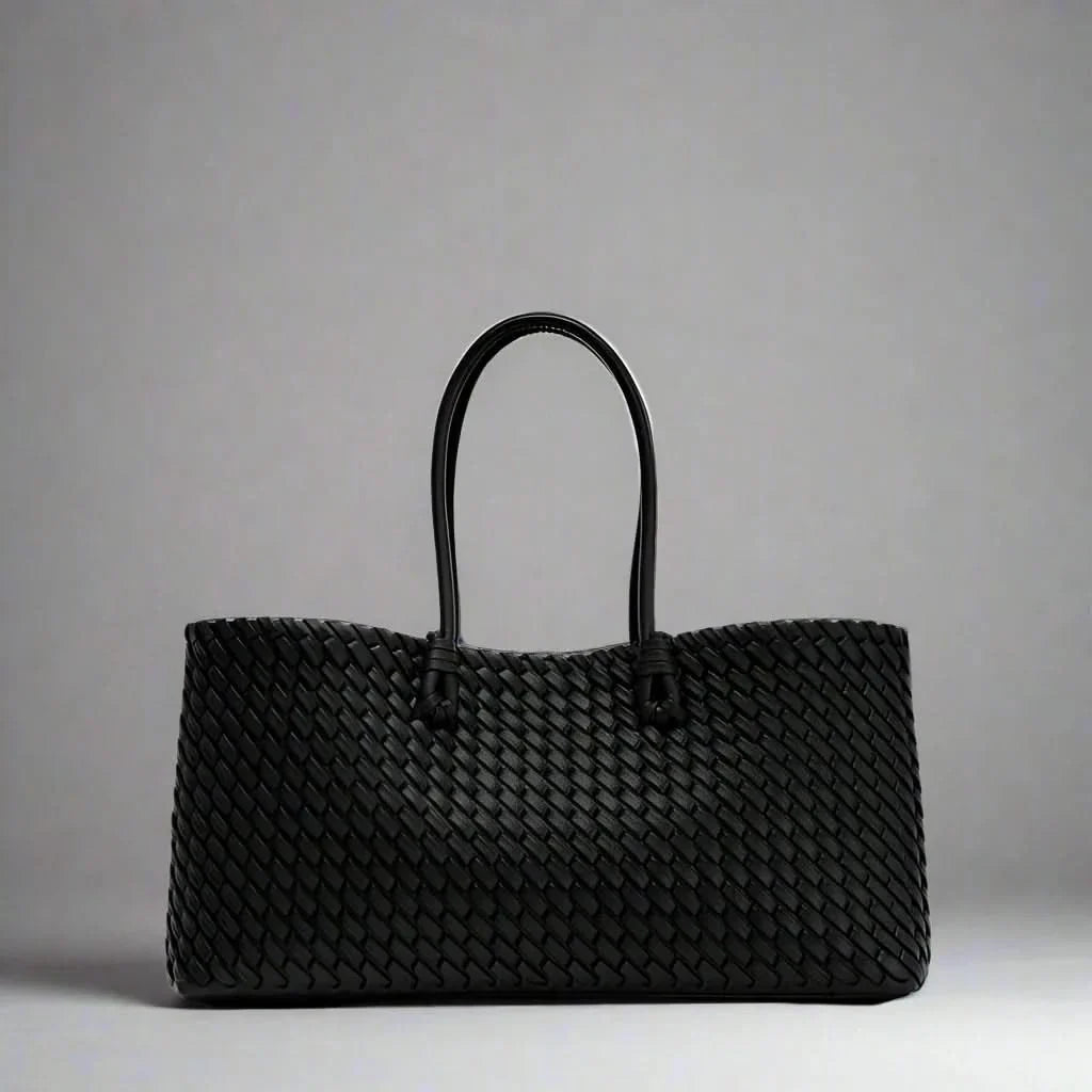 Elegant women's woven leather everyday bag, a sophisticated fashion purse accessory.