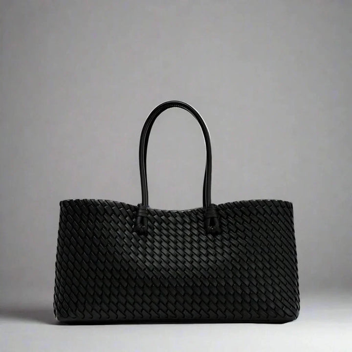 Elegant women's woven leather everyday bag, a sophisticated fashion purse accessory.