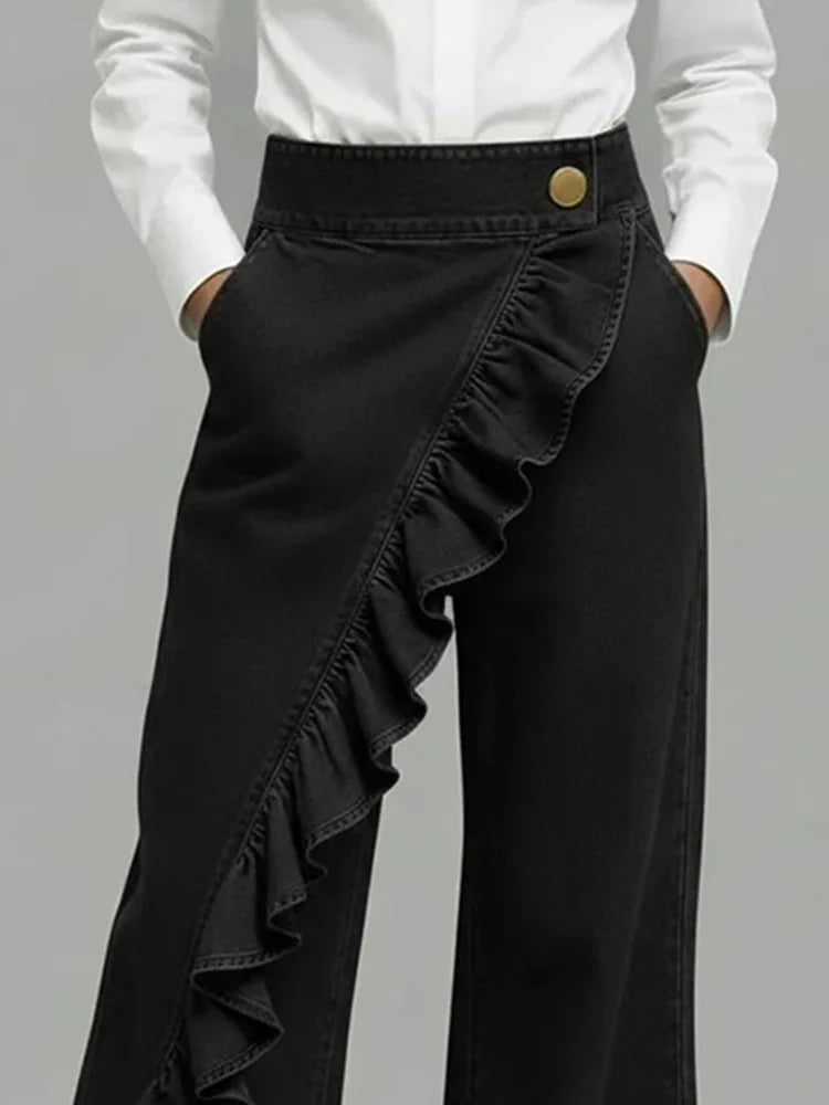 Woman posing in modern high-rise wide leg jeans featuring unique ruffle detail. Stylish casual statement pants.