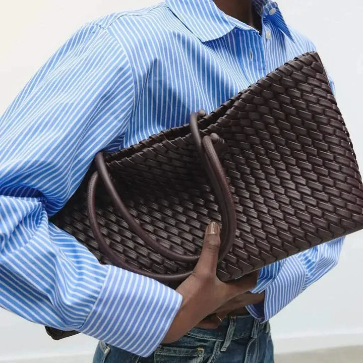 Classic woven leather women's handbag, an essential elegant accessory for daily use.