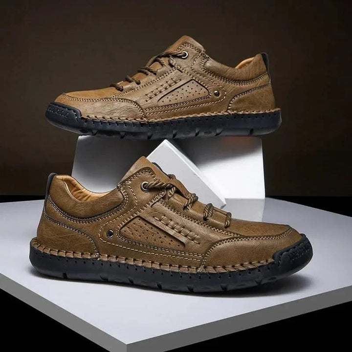 Back view of men's Crosswind trail shoes, highlighting heel support and rugged design for adventure travel.
