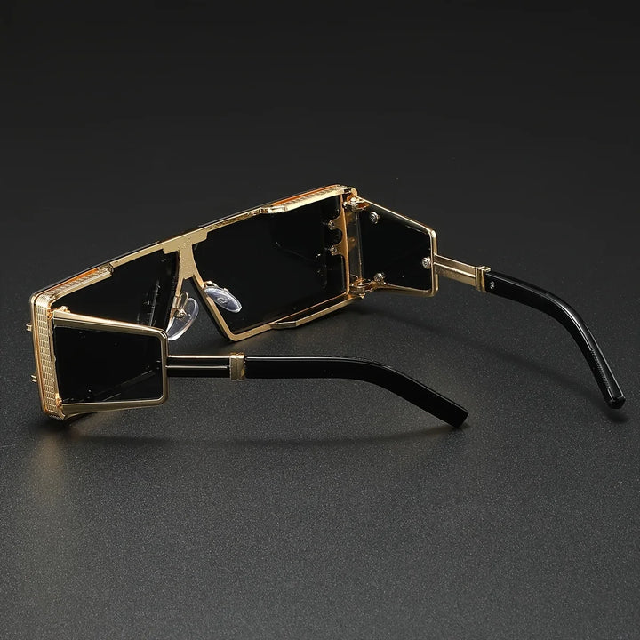 Fashion-forward geometric sunglasses with bold frames and UV protection. A trendy unisex accessory with gold detail.