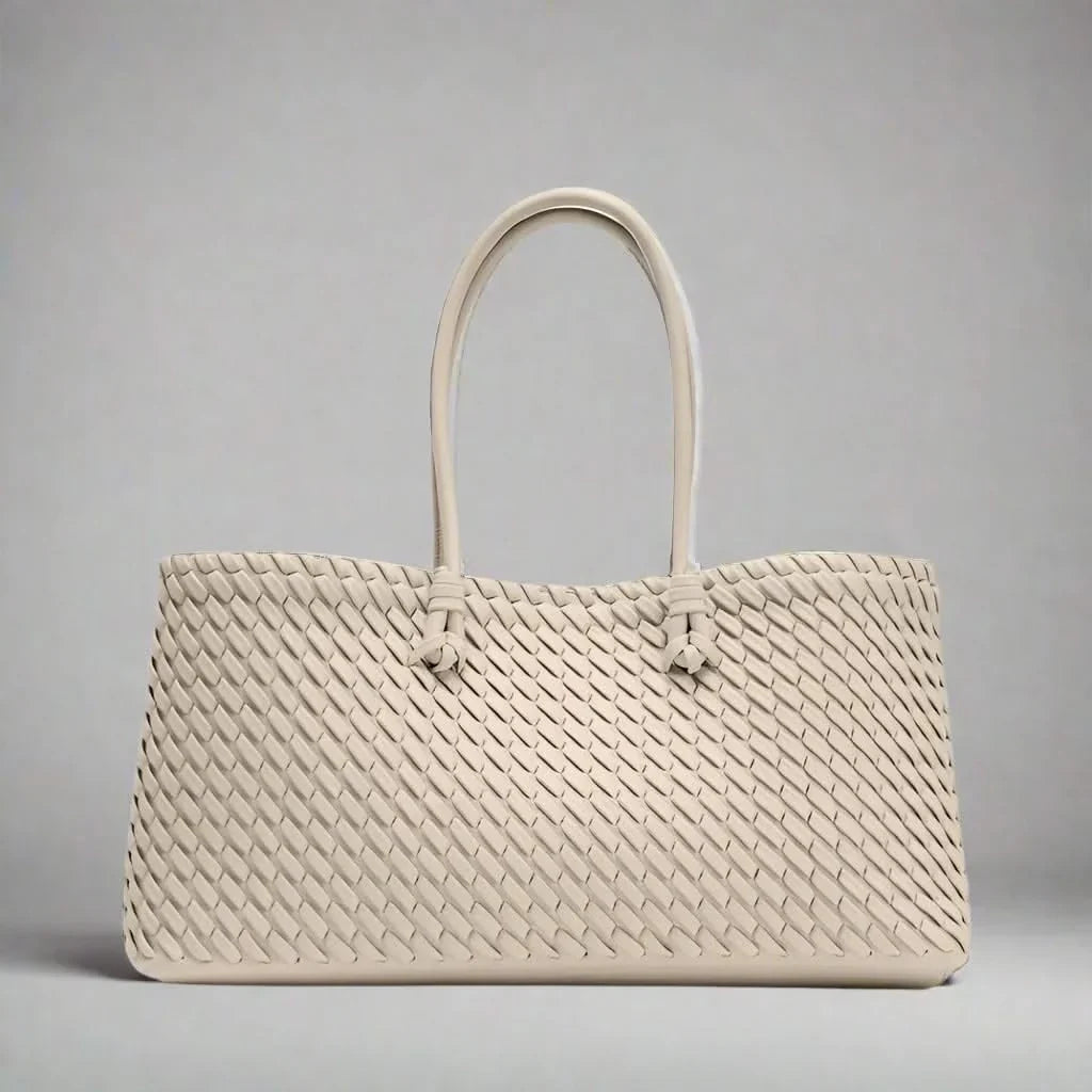 Chic women's woven leather handbag, an elegant everyday purse and fashion accessory.