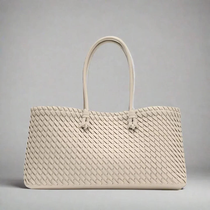 Chic women's woven leather handbag, an elegant everyday purse and fashion accessory.